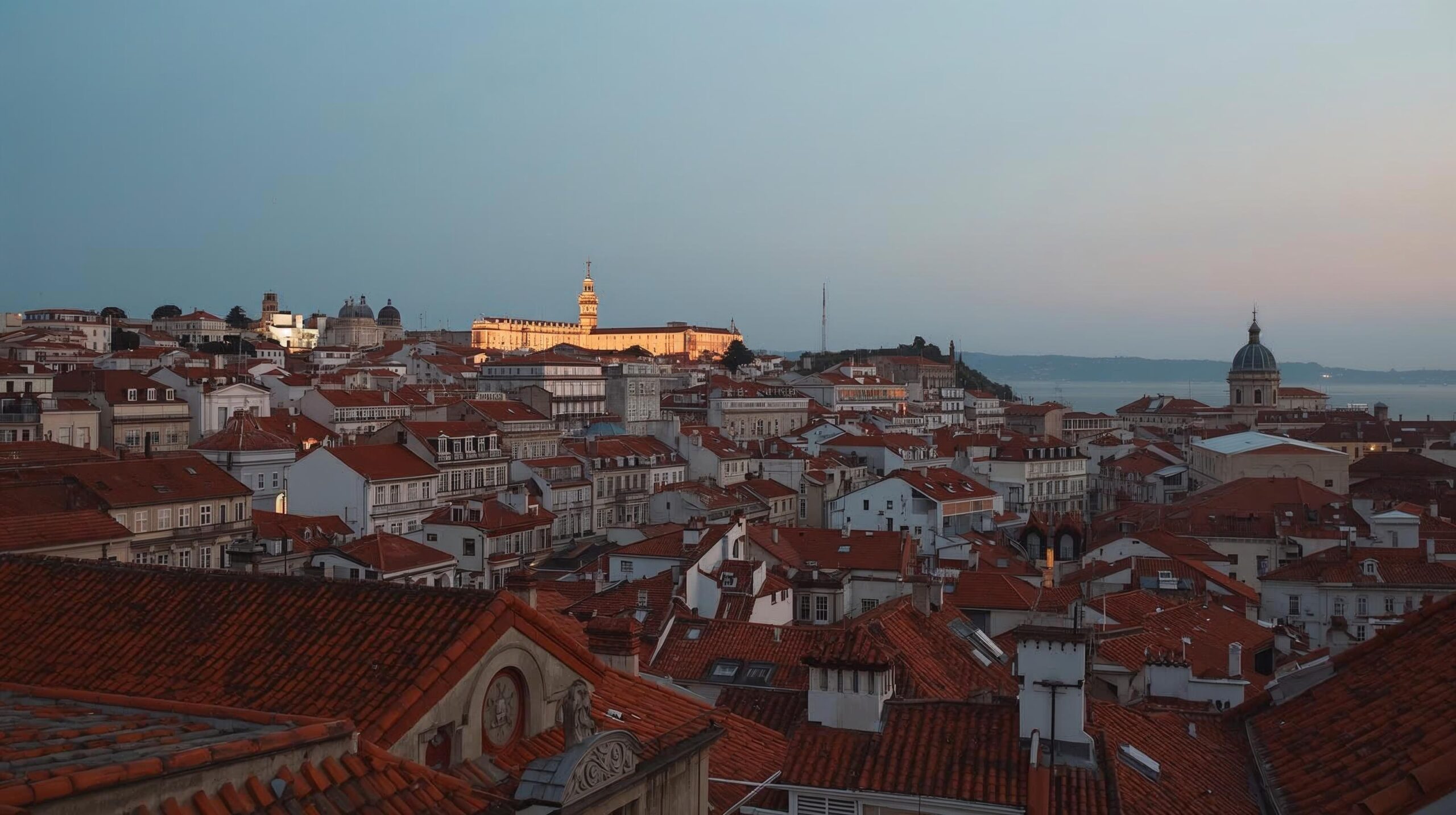 slow-travel-lisbon-balcony Evening rooftop view in Lisbon Portugal.